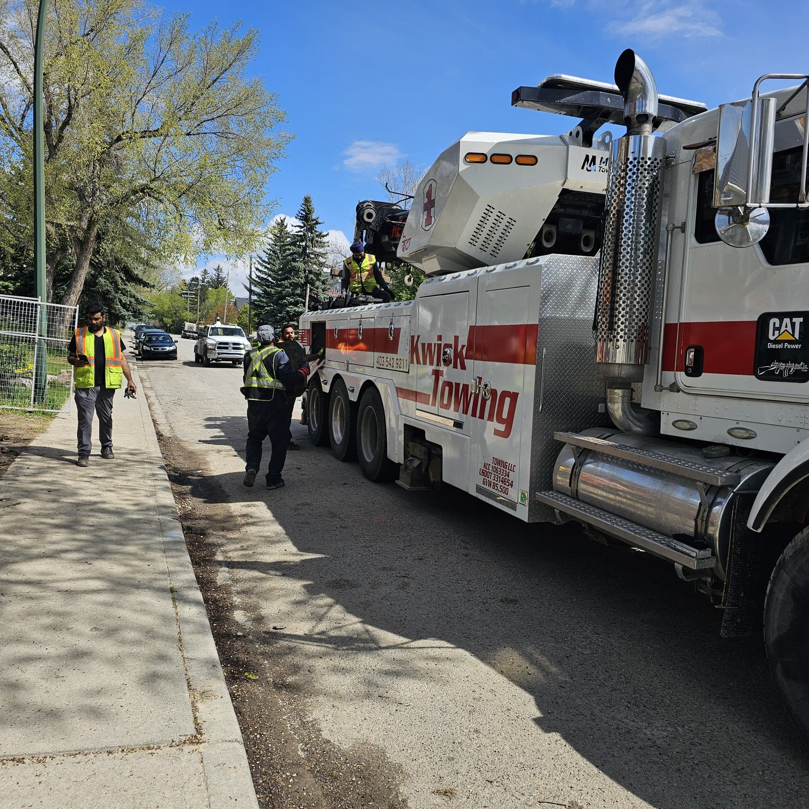 Professional tow truck driver preparing for a job in Calgary